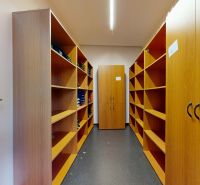 Storage spaces with shelves and cabinets in offices.