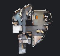 3D floor plan of offices with wood-patterned flooring and office furniture.