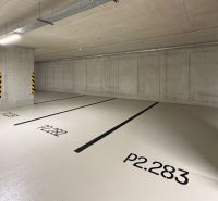 Garages with a light background and numbered parking spaces.