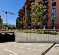 ZWIRN parking lot on Svätoplukova Street in Bratislava, surrounded by buildings and cranes.