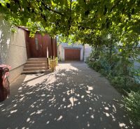 A family house on Gorazdova Street in Nitra, a shady terrace with grapevines.