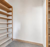 There is a storage space with shelves and tiles in the 4-room apartment.