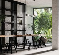 Interior with a long table, chairs, and large glass windows. Apartment construction.