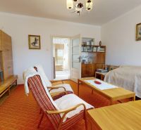 Living room of a family house with a furniture set and comfortable armchairs.