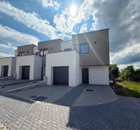 Poprad: Apartments and houses in Poprad in an environment with hills and open skies.