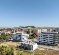 A family house in Poprad with a built-up area, garage, and paved driveway.