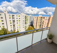 A balcony from a 4-room apartment on Halalovka in Trenčín with a view of panel apartment buildings.