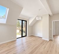 Interior of a family house with a wooden decor floor and glass doors.