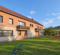 Apartment building on Bystrická Street in Rajec with a garden and a children's playground.