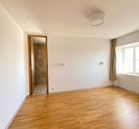 A room on Hlboká Street in a 3-room apartment with wooden flooring and a window.