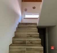 A staircase with wooden decor steps in a 4-room apartment.