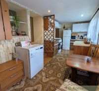 Kitchen in a family house with a dining table and kitchen counter.