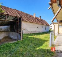 A family house in Žiar with a shelter and a grassy garden.