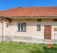 A family house in Žiar with a red roof and orange facade.