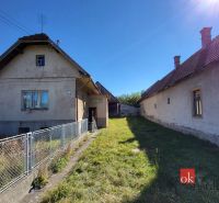 A family house in Žiar with a garden and two buildings, on the sunny side.