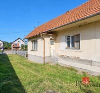 A family house in Žiar with a sloped roof and a grassy yard.