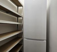 Shelf and refrigerator in the storage space of a 2-room apartment.