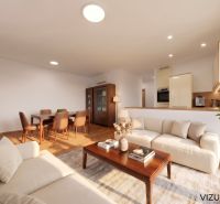 Living room in a 3-room apartment with cream sofas and wood-patterned flooring.