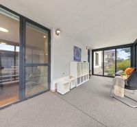 The 3-room apartment has a glazed terrace with comfortable seating and storage space.