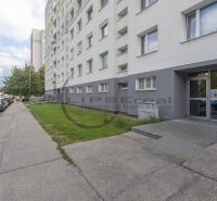 Apartment building on Eisnerova Street in Bratislava - Devínska Nová Ves surrounded by a parking lot.
