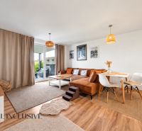 Living room in a family house with a corner sofa and decorative accessories.