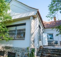 A family house on Chmeľová dolina in Nitra with a stone plinth and a terrace.