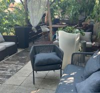 Garden terrace with comfortable seating and plants, ideal for relaxation in Bratislava.