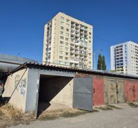 Garages on Jantárová Street in Košice, Juh district, in front of the apartment buildings.