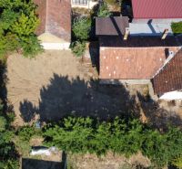 A family house on St. Florian Square in Krakovany with an adjacent empty plot.