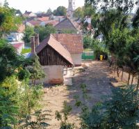 A family house on St. Florian Square in Krakovany with surrounding greenery.