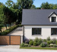 Family house on St. Florian Square in Krakovany, garden with a wooden gate.