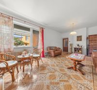 Living room in a family house with comfortable furniture and a wooden decor floor.