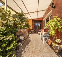 Terrace at the family house on Lajos Kossuth Street in Dunajská Streda with plants and furniture.