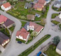 A family house in Púchov with a sloped roof and a garden in a quiet location.