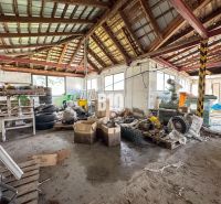 The interior of a family house with clutter and a lot of stored items and tires.