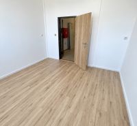 Office with white walls and a wooden decor floor.
