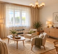 Living room with wood-patterned flooring in a family house. Elegant furniture and decorations.