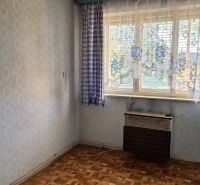 Interior of a family house with wallpapers, curtains, and a wooden decor floor.
