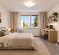 Bedroom in a 2-room apartment with a desk, large window, and comfortable bed.