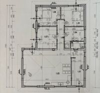 Ground floor plan of a family house with kitchen, living room, and bedroom areas.