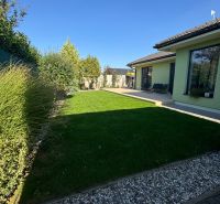 Garden at the family house on Figová Street in Bernolákovo with a lawn and a terrace.
