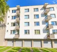 Apartment complex on Vážska Street in Piešťany with balconies and garage doors.