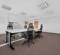 Offices with a conference table, ergonomic chairs, and storage cabinets.
