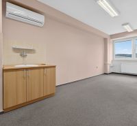 Office with a sink, air conditioning, and a view of the hills; bright walls and carpet.