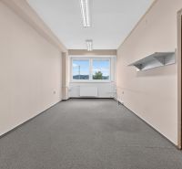 Offices with carpet, white walls, and a window, ideal for a workspace.