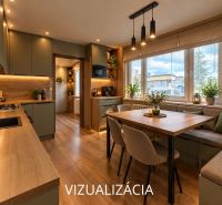Kitchen and dining area in a studio apartment with a wood-patterned floor.