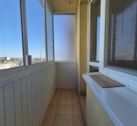 A balcony in a studio apartment with a view of Bystrická Street in Pezinok.