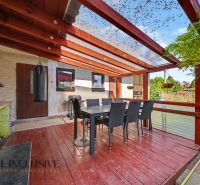 In Trstice, a family house with a terrace, table, chairs, and a fireplace for grilling.