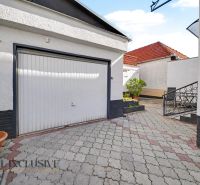 A family house in Trstice with paving and a garage, suitable for safe parking.