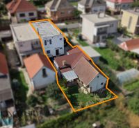 Family house in Trstice, yard and surrounding buildings in a built-up urban area.